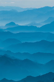 misty mountains in blue